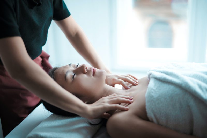 Physiotherapy treating a woman's neck